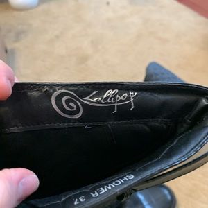 Black knee high rain boots European brand